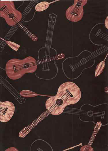 Ukulele instruments on a black cotton apparel fabric