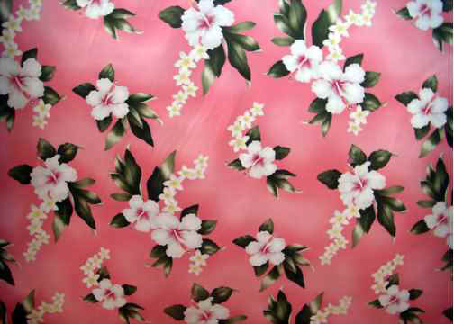 Hibiscus and plumeria flowers on cotton poplin apparel fabric. 